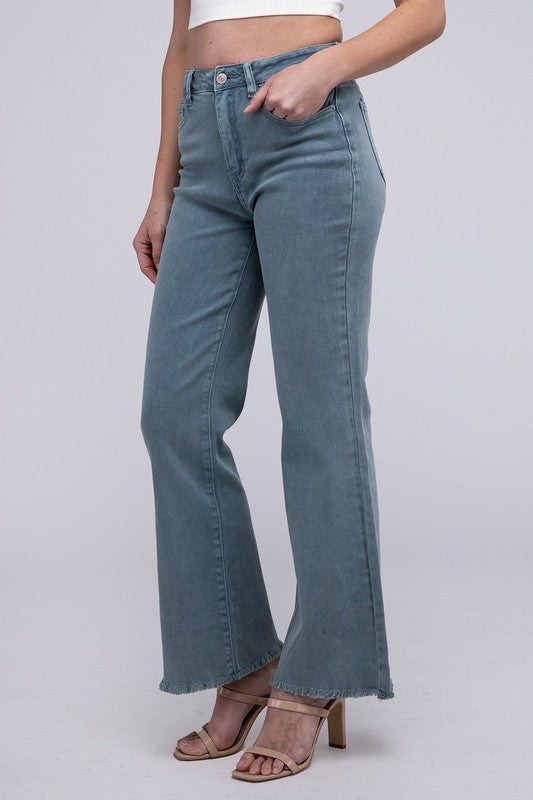 A person standing in Acid Washed Frayed Cutoff Hem Straight Wide Pants with black heeled sandals against a plain background.