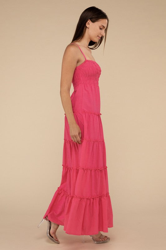 A woman modeling a Woven Smocked Top Tiered Cami Maxi Dress against a neutral background.