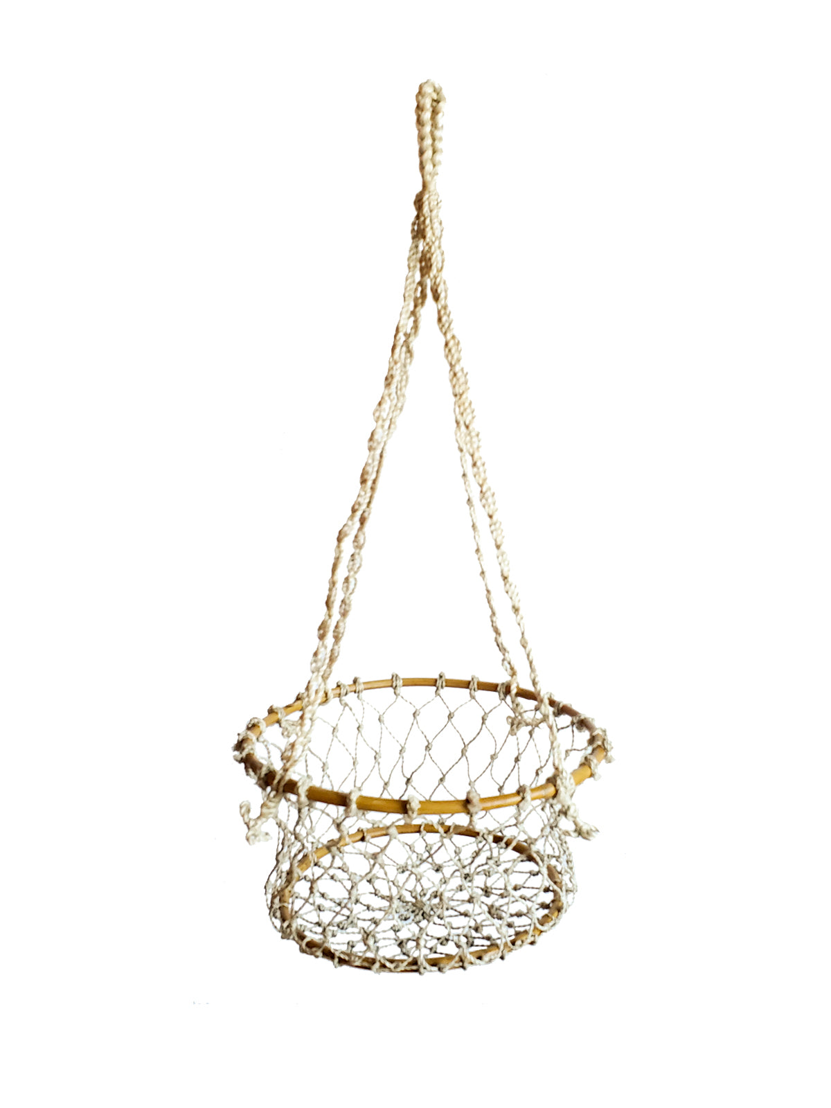 The Jhuri Single Hanging Basket, crafted from natural jute by Fair Trade artisans, cradles a lush plant with trailing green leaves against a plain white background, beautifully combining elegance and sustainability.