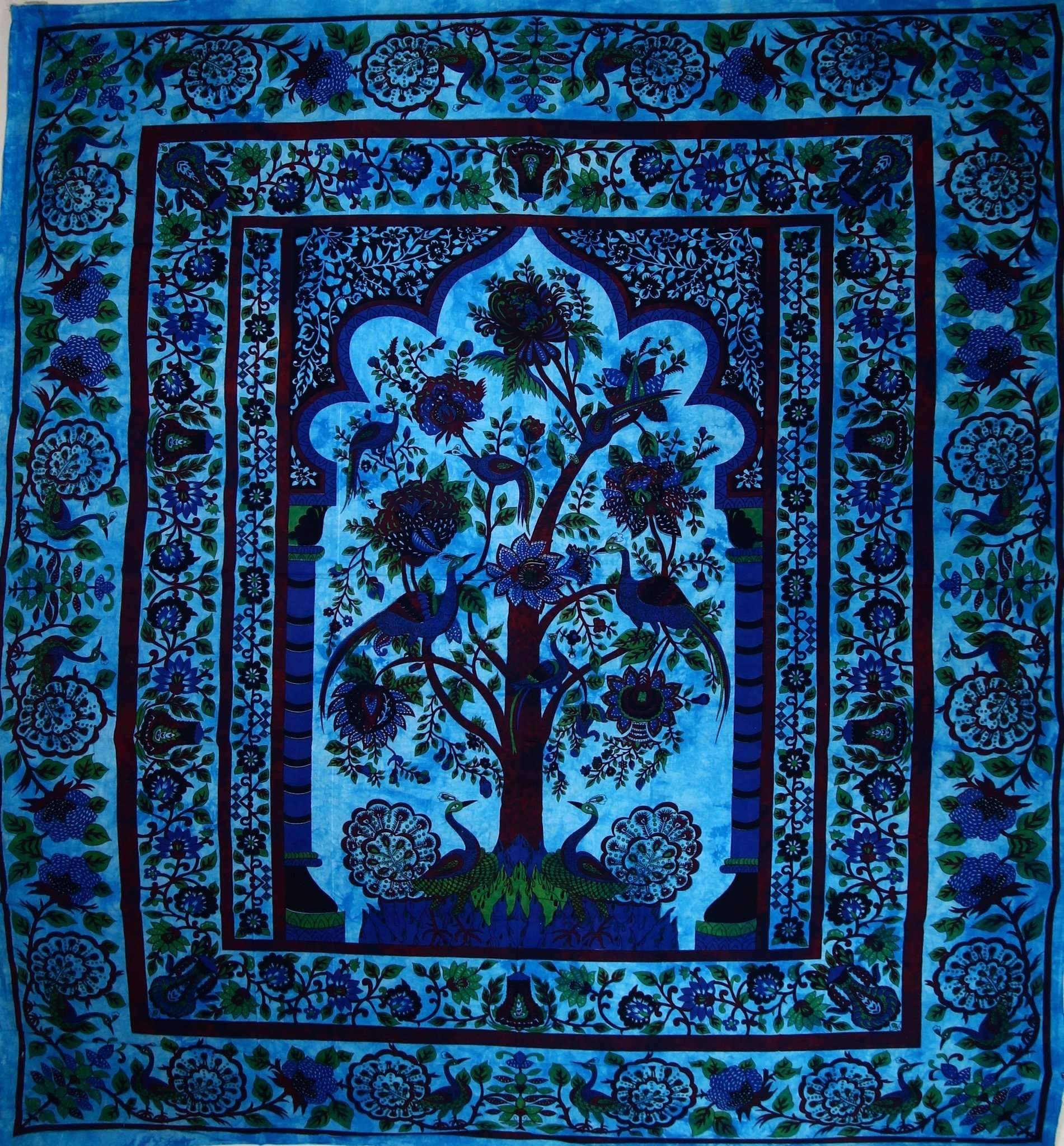 The Turquoise Tree of Life Peacock Tapestry features a central tree adorned with intricate floral patterns in shades of blue and green, crafted from handmade cotton.