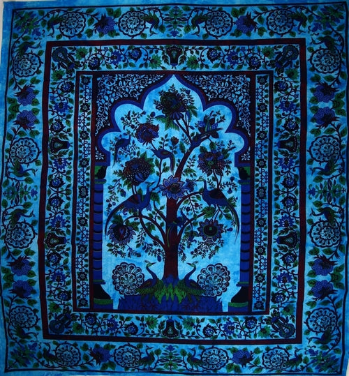 The Turquoise Tree of Life Peacock Tapestry features a central tree adorned with intricate floral patterns in shades of blue and green, crafted from handmade cotton.