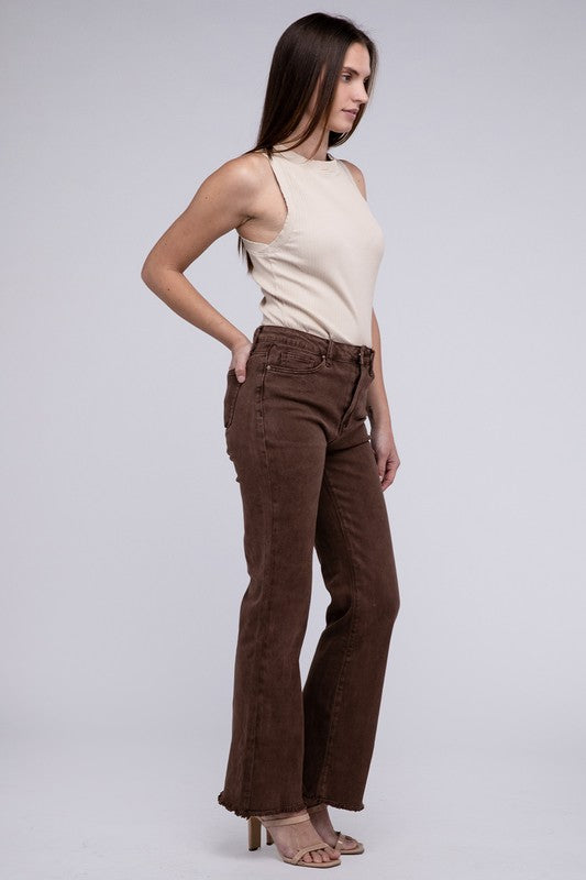 A person standing in Acid Washed Frayed Cutoff Hem Straight Wide Pants with black heeled sandals against a plain background.