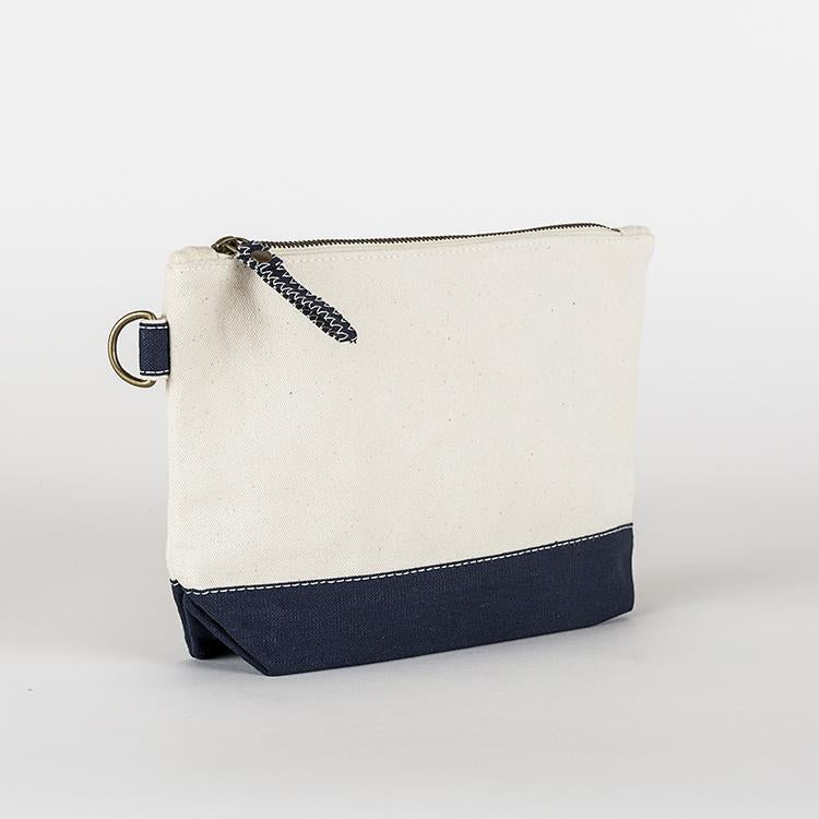 A small heavyweight canvas pouch with a black bottom, featuring a sturdy metal zipper and side loop detail, from the All In Zip Top Pouch collection.