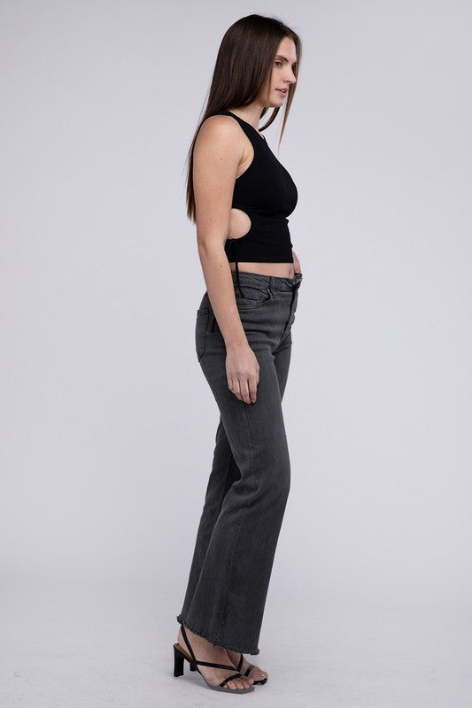 A person standing in Acid Washed Frayed Cutoff Hem Straight Wide Pants with black heeled sandals against a plain background.