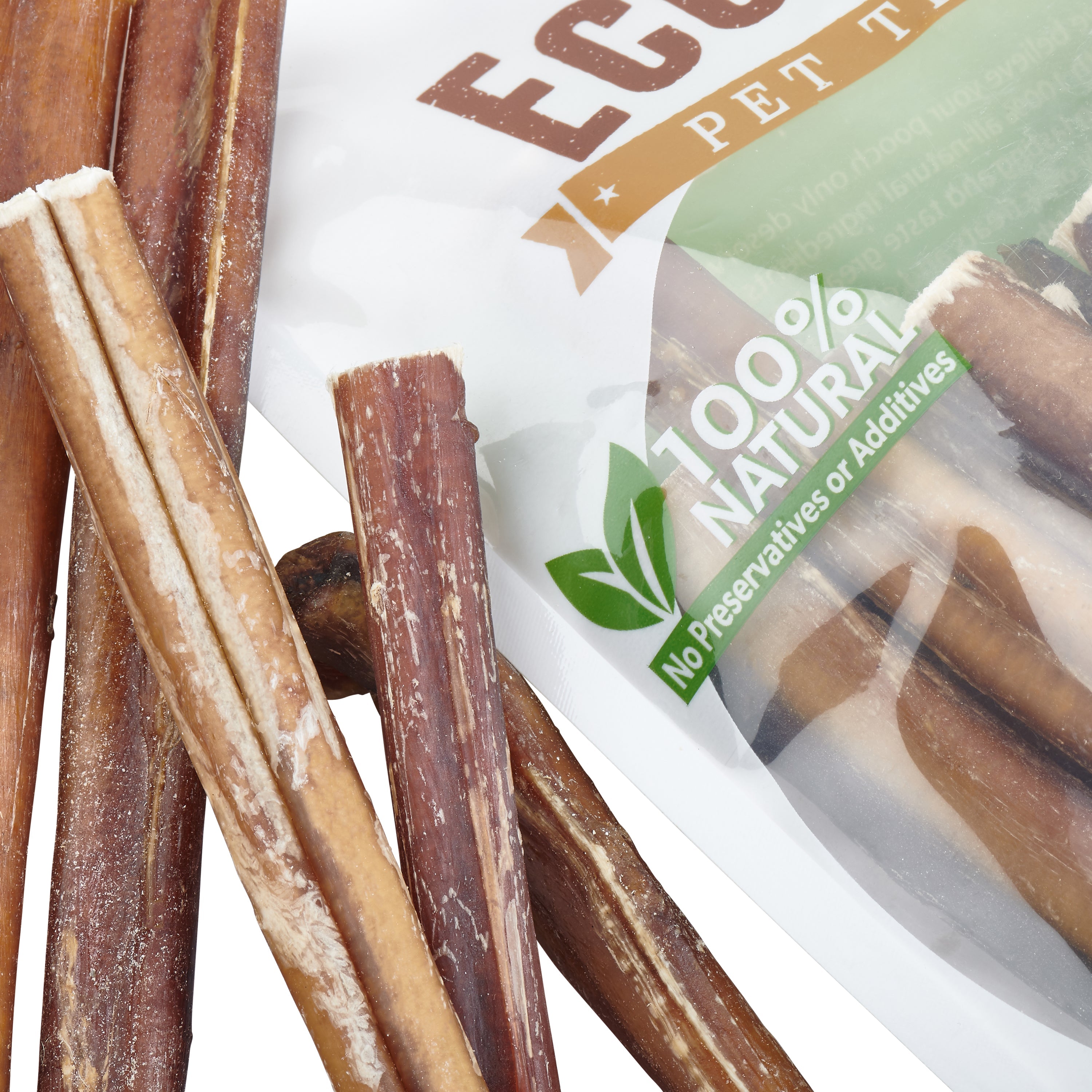 The packaging of the Brazilian Grass-Fed Beef Bully Sticks features an image of a joyful dog and prominently declares 100% natural ingredients. The bag is filled with brown treats, emphasizing the use of premium grass-fed bully sticks for your furry companion.