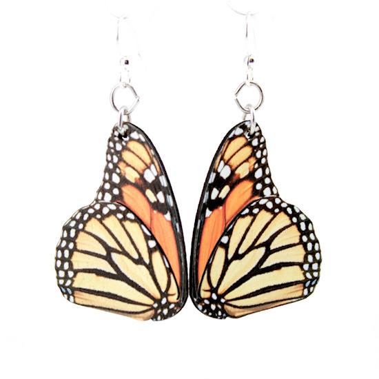 The Monarch Butterfly Earrings #1561 showcase orange and black patterns with white spots, resembling butterfly wings. Made from silver-finished stainless steel, they are hypoallergenic and incorporate sustainably sourced wood elements.