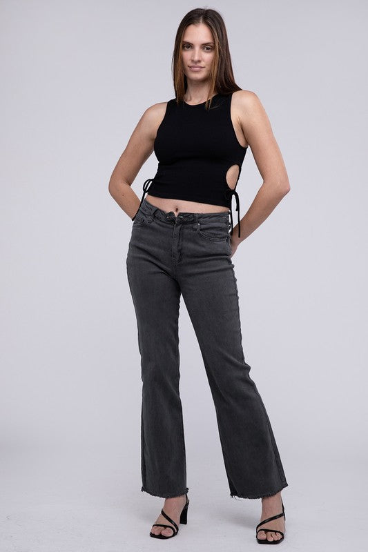 A person standing in Acid Washed Frayed Cutoff Hem Straight Wide Pants with black heeled sandals against a plain background.