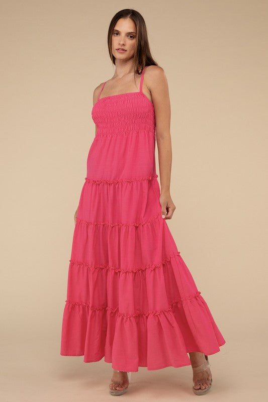 A woman modeling a Woven Smocked Top Tiered Cami Maxi Dress against a neutral background.