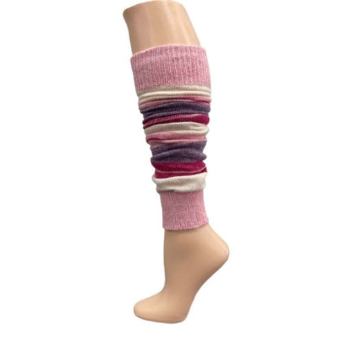 The Girl's Stripe Lambswool Knee Hi Leg Warmers, adorned with colorful stripes in blue, pink, purple, and white, are showcased on a mannequin leg as cozy essentials for the cold season.