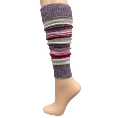 The Girl's Stripe Lambswool Knee Hi Leg Warmers, adorned with colorful stripes in blue, pink, purple, and white, are showcased on a mannequin leg as cozy essentials for the cold season.