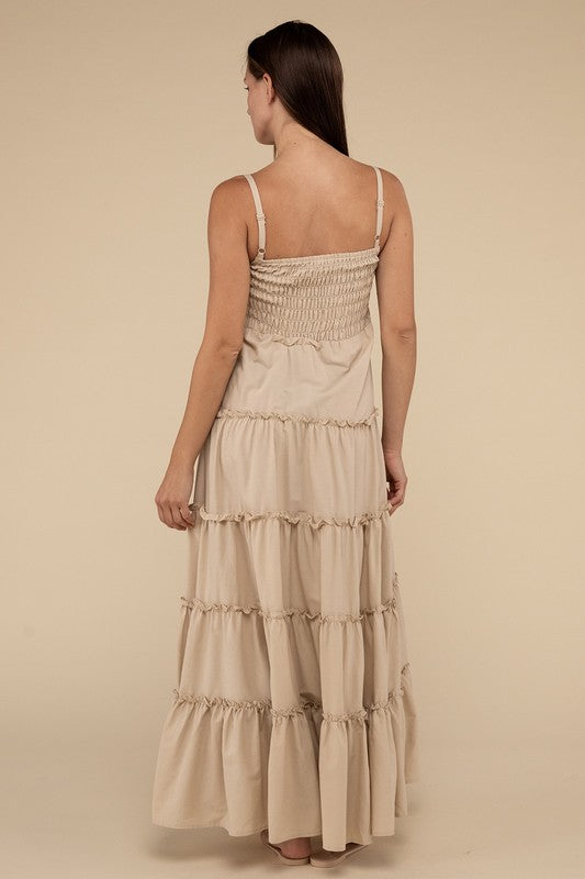 A woman modeling a Woven Smocked Top Tiered Cami Maxi Dress against a neutral background.