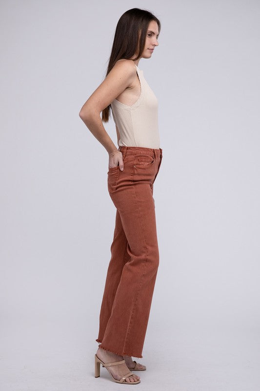 A person standing in Acid Washed Frayed Cutoff Hem Straight Wide Pants with black heeled sandals against a plain background.