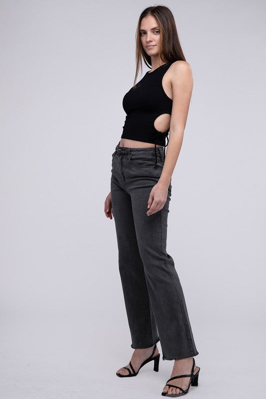 A person standing in Acid Washed Frayed Cutoff Hem Straight Wide Pants with black heeled sandals against a plain background.