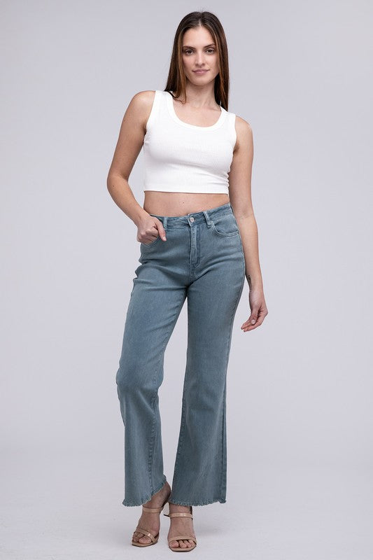 A person standing in Acid Washed Frayed Cutoff Hem Straight Wide Pants with black heeled sandals against a plain background.