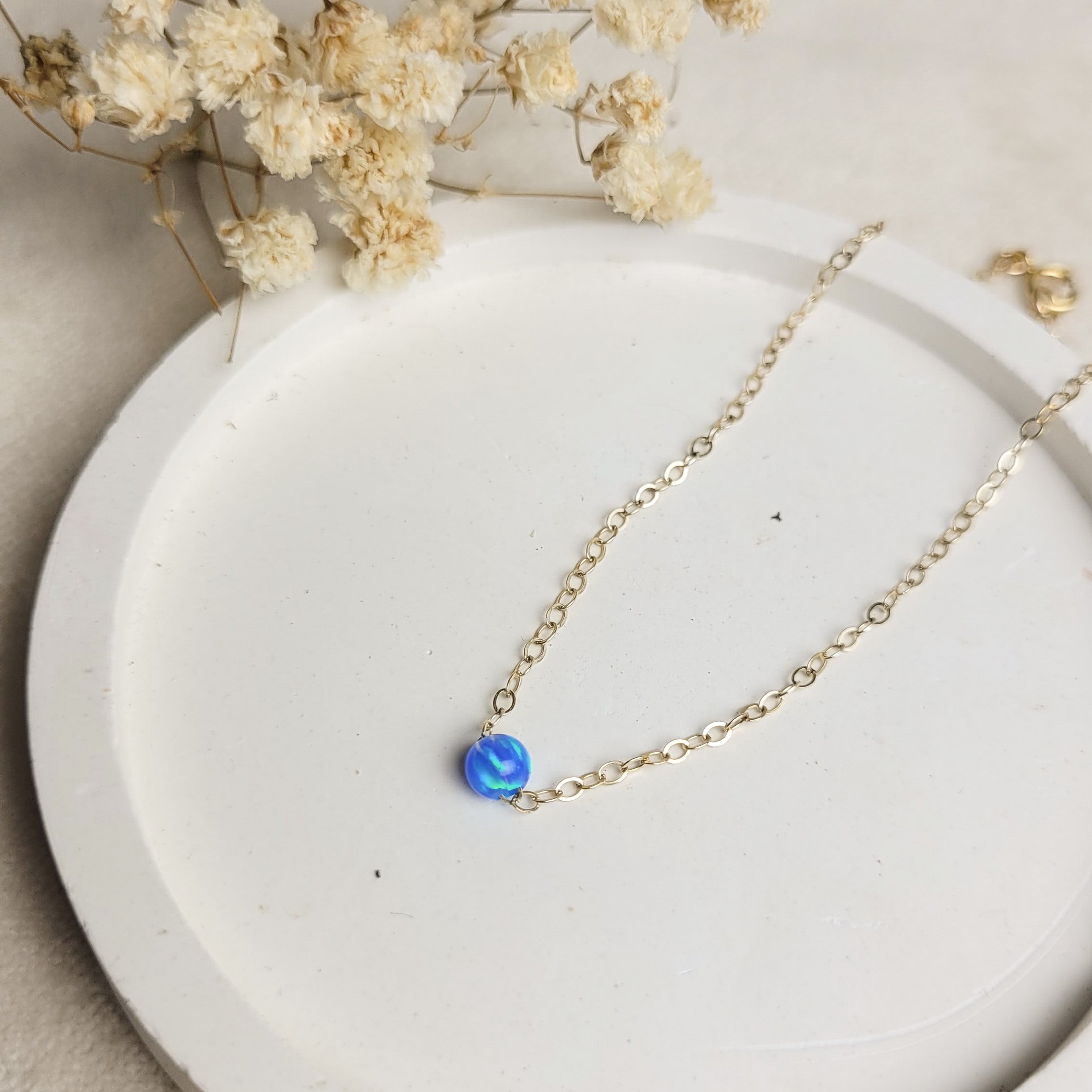 Dark Blue Rebecca Bracelet, showcased on a white hexagonal board featuring "TAYO" and the slogan text below.