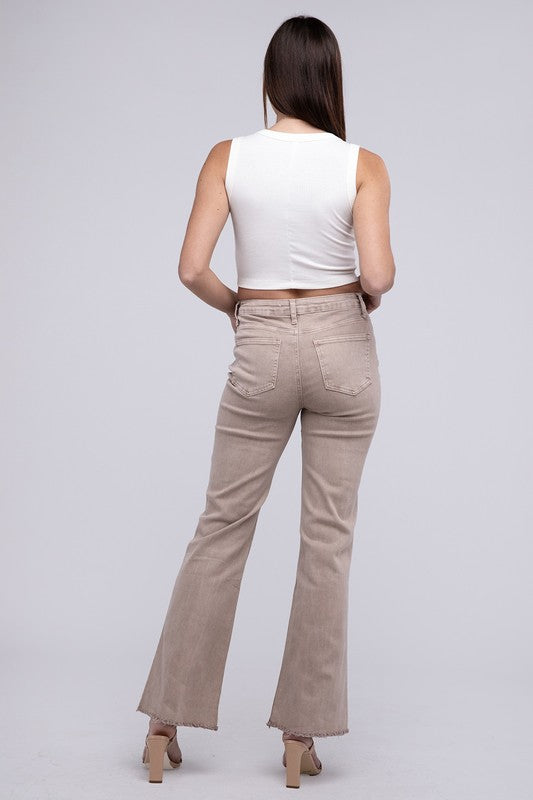 A person standing in Acid Washed Frayed Cutoff Hem Straight Wide Pants with black heeled sandals against a plain background.