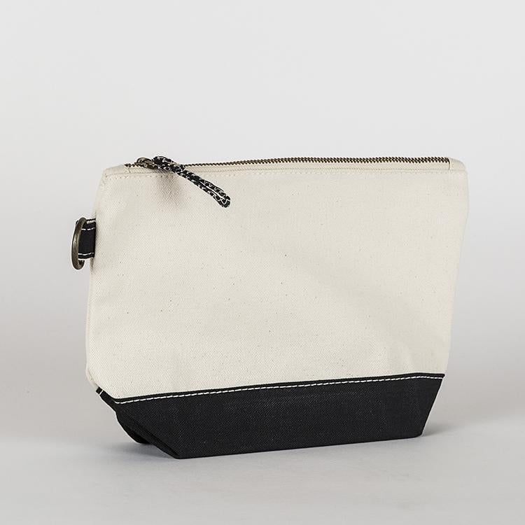 A small heavyweight canvas pouch with a black bottom, featuring a sturdy metal zipper and side loop detail, from the All In Zip Top Pouch collection.