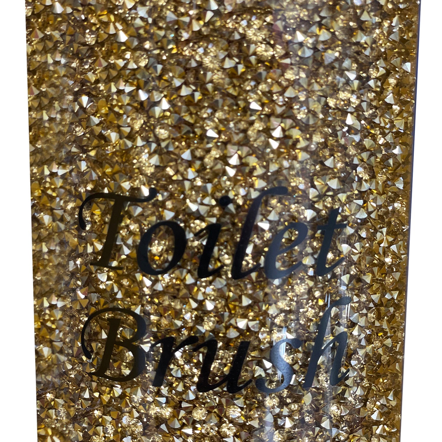 A Toilet Brush Holder with Brush in Gift Box, Gold Crushed Diamond Glass next to a tin can.