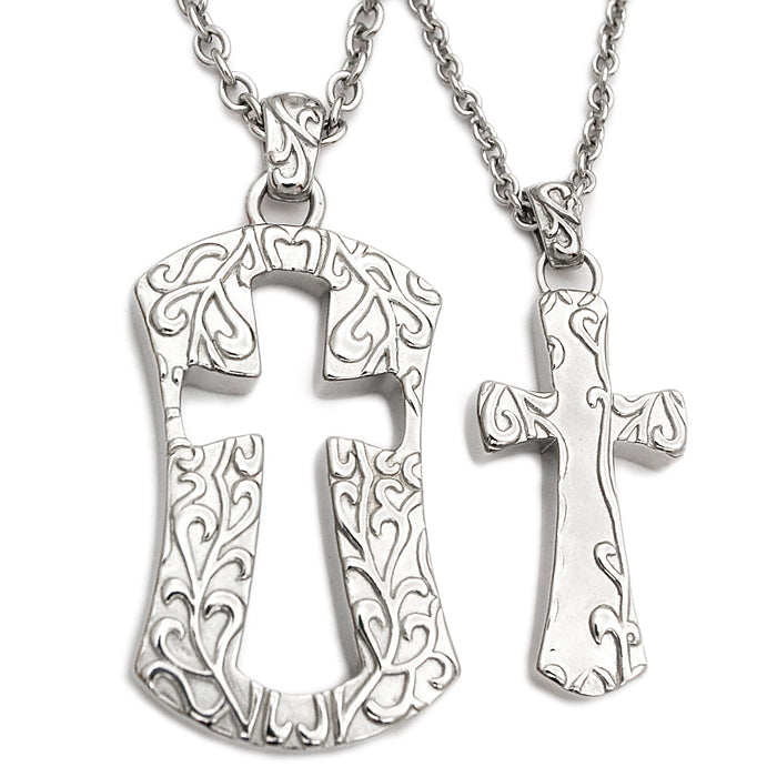 Two Couple Cross Necklaces with ornate silver pendants featuring intricate scrollwork designs.