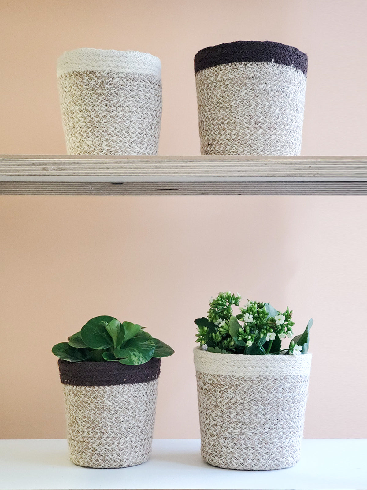 The Agora Plant Baskets in a light brown and cream pattern are showcased side by side on a plain white background, highlighting sustainable home decor crafted by Fair Trade artisans.