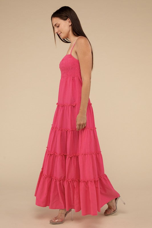 A woman modeling a Woven Smocked Top Tiered Cami Maxi Dress against a neutral background.