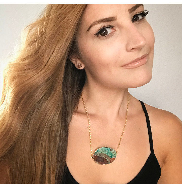 A pair of Raw Citrine Chunk Earrings, also known as Geo Earrings or Rock Stud Earrings, are elegantly showcased on a dark background, highlighting the allure of unique crystal jewelry.