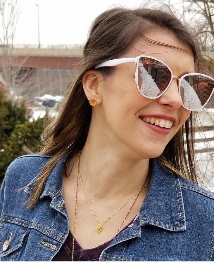 A pair of Raw Citrine Chunk Earrings, also known as Geo Earrings or Rock Stud Earrings, are elegantly showcased on a dark background, highlighting the allure of unique crystal jewelry.