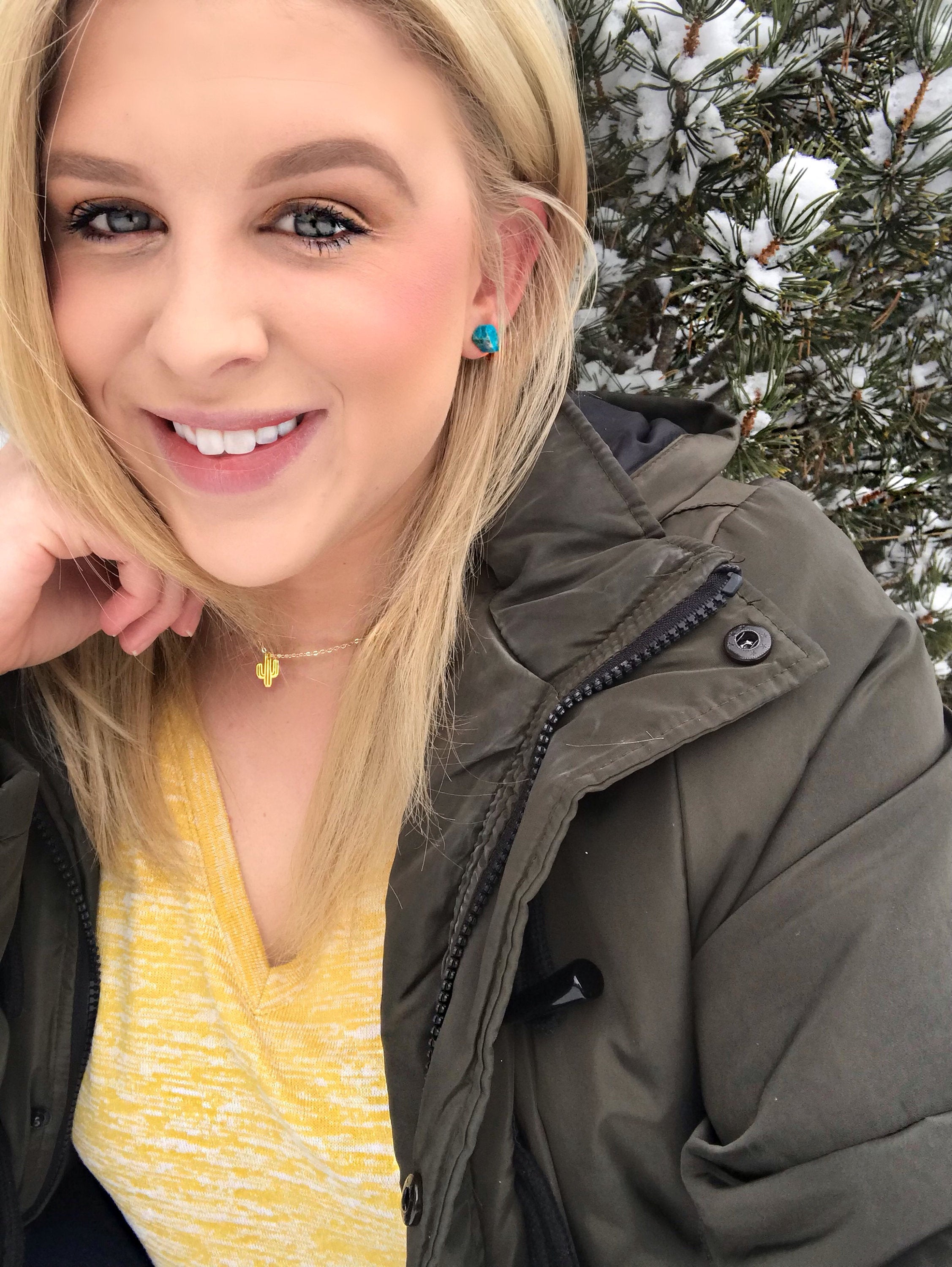Close-up of Raw Chrysocolla Chunk Earrings, Rock Stud Earrings, Crystal Earrings with surgical steel earring posts on a dark gray background.