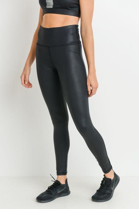 A person wearing Highwaist Foil Scale Print Full Leggings and black sneakers stands against a white background.