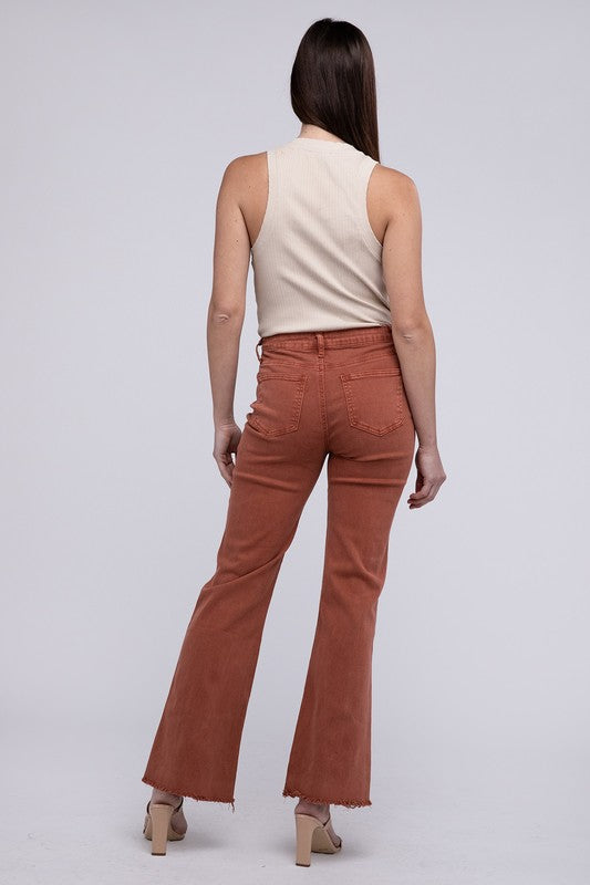 A person standing in Acid Washed Frayed Cutoff Hem Straight Wide Pants with black heeled sandals against a plain background.