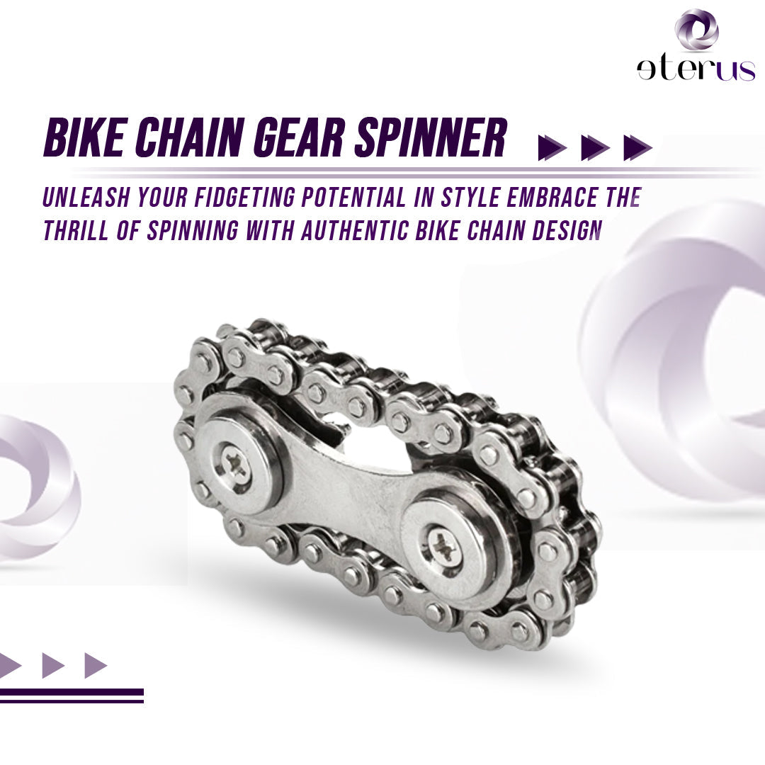 A Bike Chain Gear Spinner with two rivets lies on a glossy white surface, evoking the image of a sleek gear fidget spinner crafted for contemporary stress relief.
