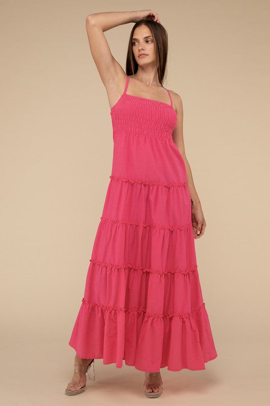 A woman modeling a Woven Smocked Top Tiered Cami Maxi Dress against a neutral background.
