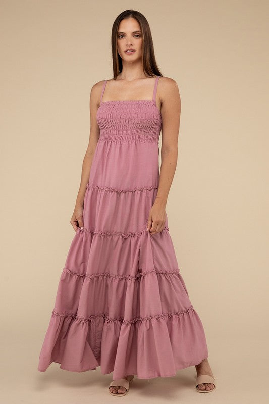 A woman modeling a Woven Smocked Top Tiered Cami Maxi Dress against a neutral background.
