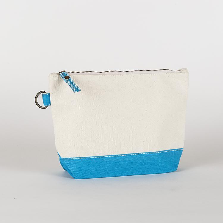 A small heavyweight canvas pouch with a black bottom, featuring a sturdy metal zipper and side loop detail, from the All In Zip Top Pouch collection.