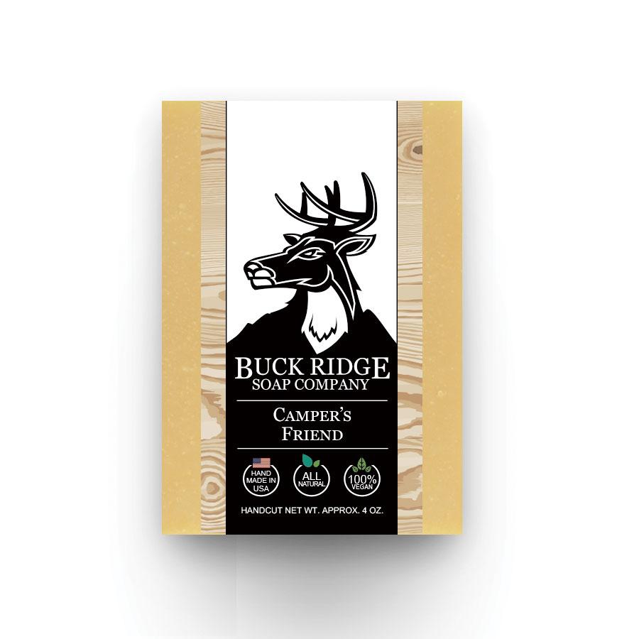Explore the Campers Friend Men's Handmade Soap by Buck Ridge Soap Company, adorned with a deer logo. This all-natural, handcrafted soap is proudly made in the USA and serves as a natural alternative to DEET, thanks to its essential oils that are ideal for camping. It’s 100% vegan and comes in a weight of approximately 4 oz.