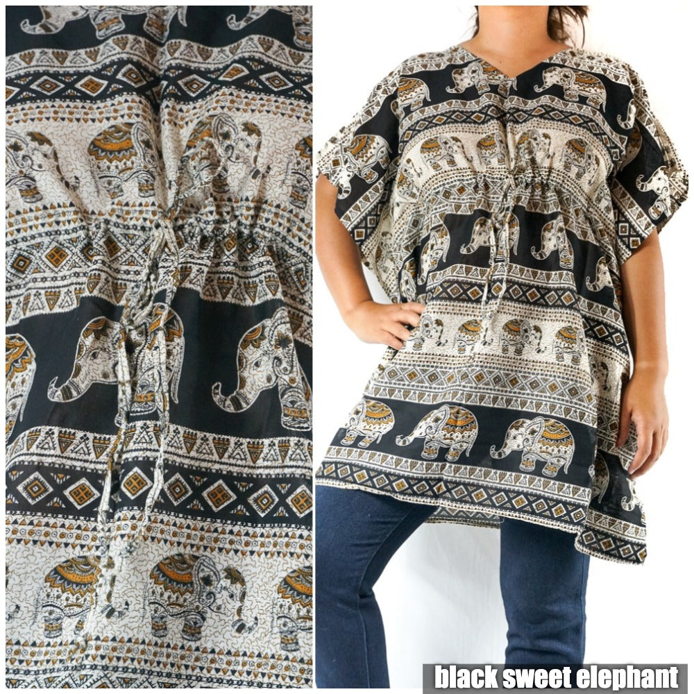 A Boho Elephant Kaftan Dress, crafted from breathable rayon, showcases a bold black tunic with white elephant and floral patterns. The wearer confidently places one hand on their hip as the brand "big elephant" subtly features in the corner.