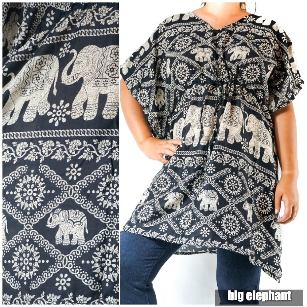 A Boho Elephant Kaftan Dress, crafted from breathable rayon, showcases a bold black tunic with white elephant and floral patterns. The wearer confidently places one hand on their hip as the brand "big elephant" subtly features in the corner.