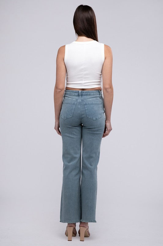 A person standing in Acid Washed Frayed Cutoff Hem Straight Wide Pants with black heeled sandals against a plain background.