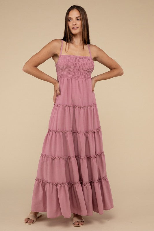 A woman modeling a Woven Smocked Top Tiered Cami Maxi Dress against a neutral background.