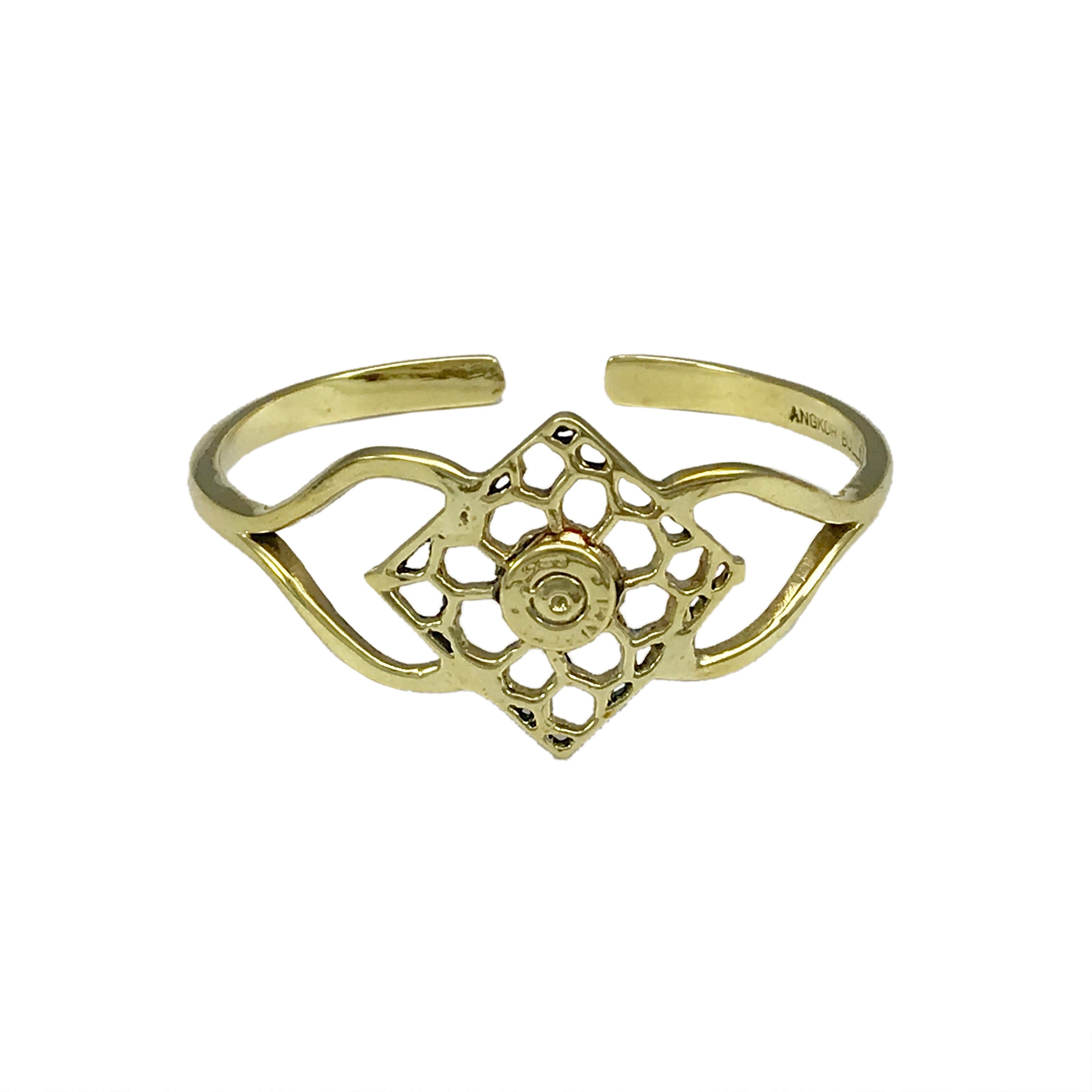 The Angkor Bullet Cuff is a stunning gold cuff bracelet that showcases an intricate openwork floral design, handcrafted with artisan craftsmanship. Made in Cambodia, this unique piece elegantly combines history and artistry by using recycled bombshell jewelry.
