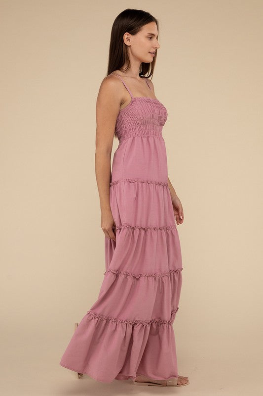 A woman modeling a Woven Smocked Top Tiered Cami Maxi Dress against a neutral background.