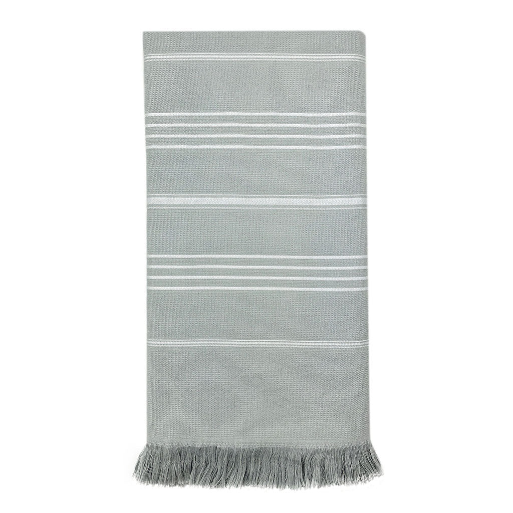 The Classic Terry Turkish Towel is a handmade white towel featuring horizontal gray stripes and fringed edges, ideal for enhancing the elegance of your bath collection.