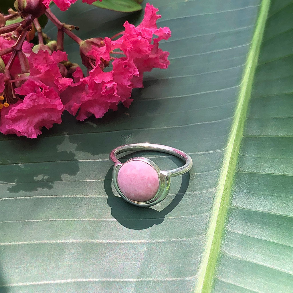 Discover the Pink Moon Ring: a sterling silver masterpiece featuring a round pink stone, beautifully set in a semi-circle bezel design.
