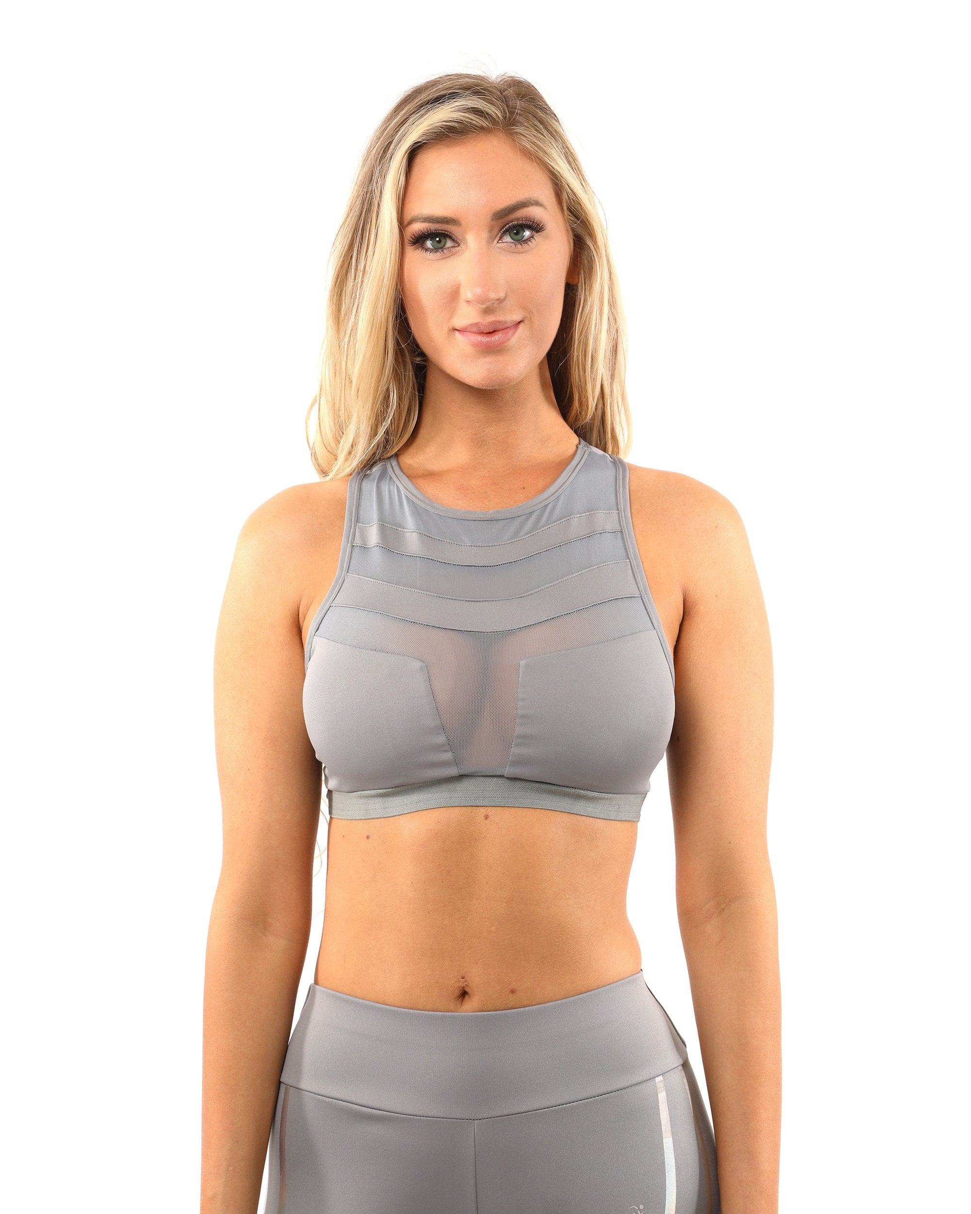 A woman wearing a Savoy Active Laguna Sports Bra in grey stands facing the camera against a white background.