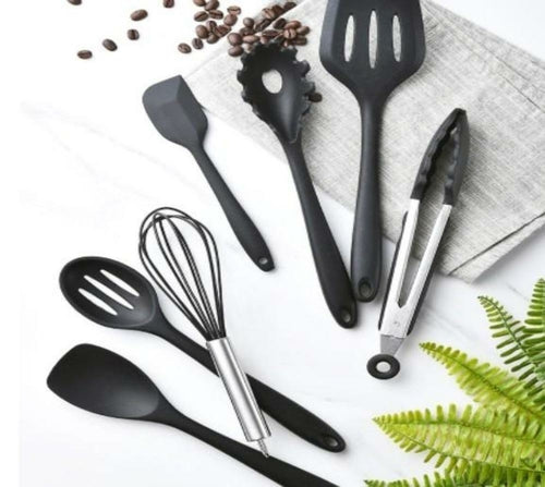 A set of Non Stick Silicone Cooking Utensils Premium Heat Resistant 10 PCS Set, including spatulas, spoons, tongs, and a whisk, arranged on a white background.