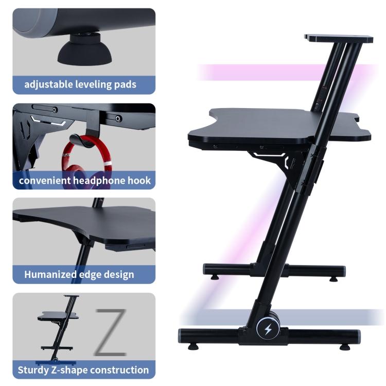 A black ModernMazing Z-Shaped Home Office Computer Gaming Desk Workstation with Carbon Fiber Surface and two legs.