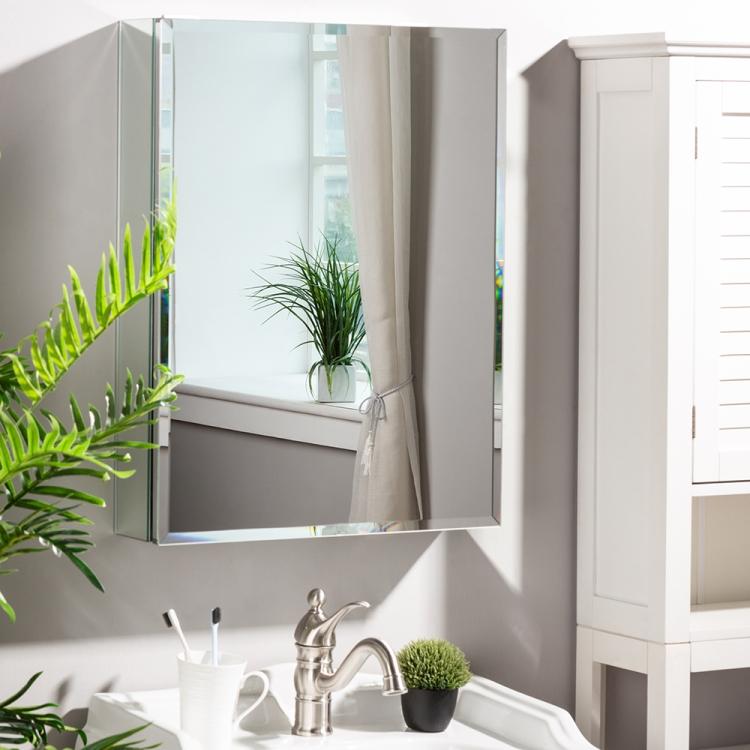 A bathroom with a ModernMazing Aluminum Wall-mounted Single Door Bathroom Mirror Cabinet with Adjustable Shelf, Size: 26 and a plant next to it.