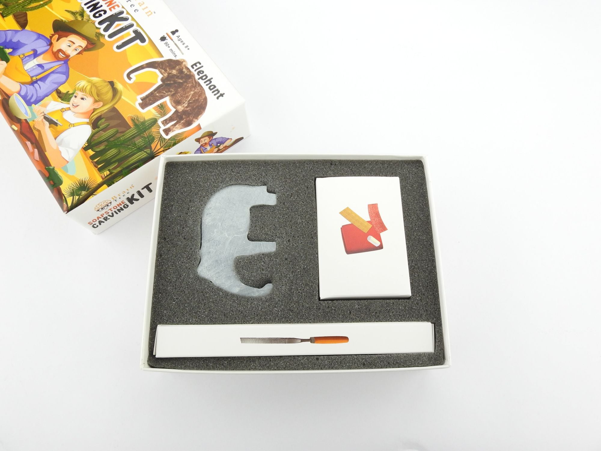 A Elephant Soapstone Carving Kit: Safe and Fun DIY Craft for Kids and Adults with an elephant and a man.