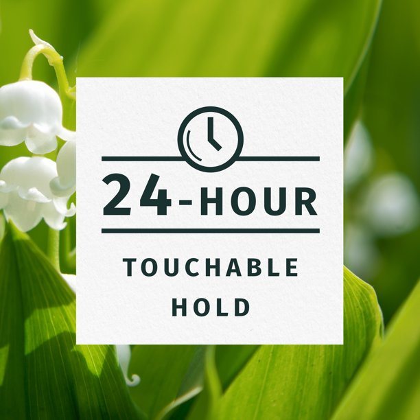 A bottle of Herbal Essences Touchable Hold Hair Spray Gel for Curly Hair with green accents on the label, displaying plant imagery.