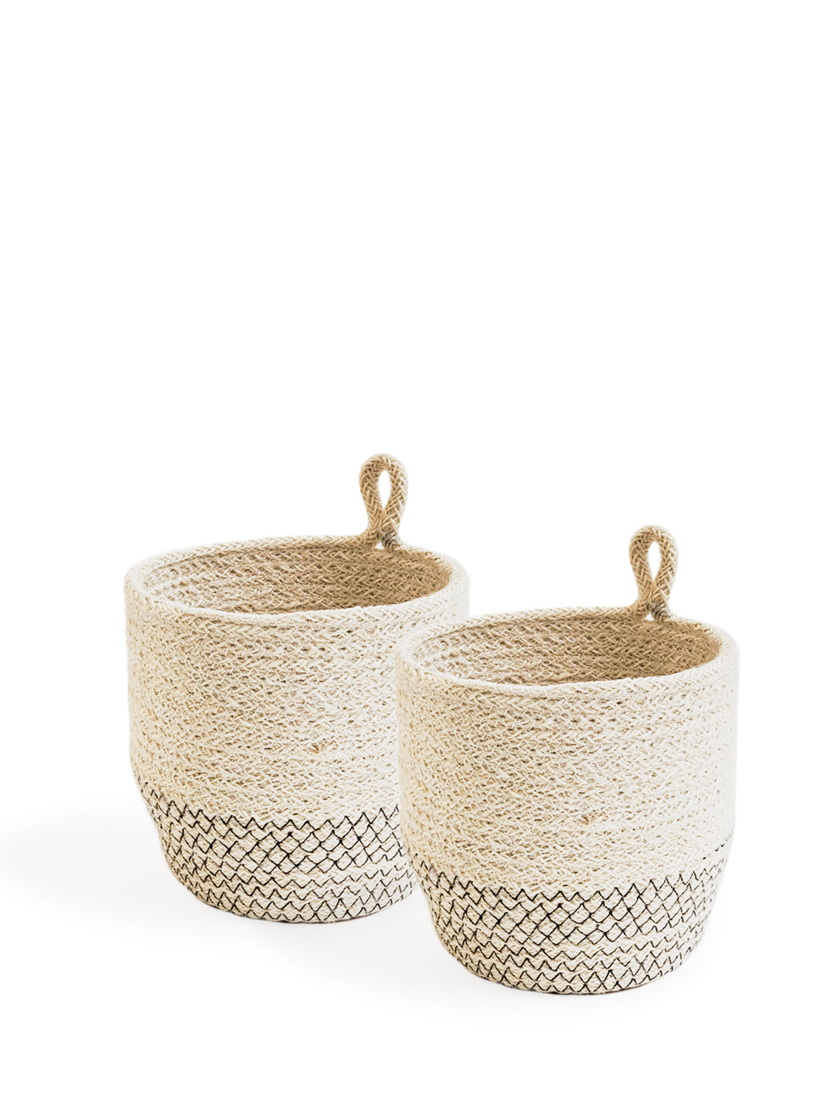 The Amari Loop Bin - Black, a beige and black woven basket featuring a loop handle, is elegantly displayed on a plain white background. Sustainably handmade by Fair Trade artisans, it seamlessly blends style with ethical craftsmanship.